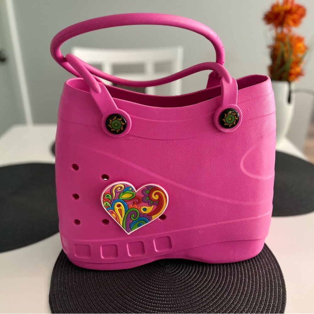Optari rubber tote with bag charm. 14” x 11” x 6”
